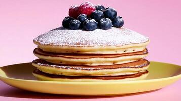 A delicious stack of fluffy pancakes topped with sugar and berries, ideal for brunch concepts or Pancake Day celebrations, styled with a vibrant pastel color palette photo