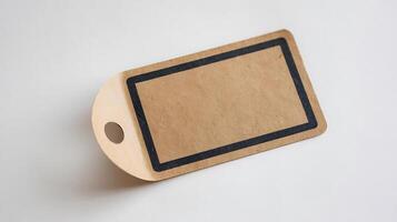 Blank brown paper tag with black border and round hole for business use on a white background photo