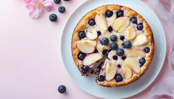 Blueberry and apple slice fresh fruit pie cake on white plate for tea time photo