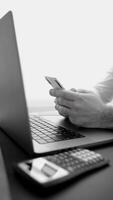 The man uses mobile and online banking on a daily basis. Transfers, bill payments and balance monitoring are now possible in just a few clicks. concept of developing banking technologies. Monochrome video