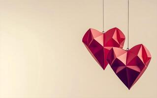 Hanging red heart shapes of paper against soft neutral background. Happy Valentines Day greeting card, header website and social media post. photo