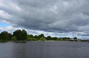 Dark Grey Storm Clouds Hovering Over the Potomac photo