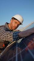 Worker Inspects Solar Panel After Installation video