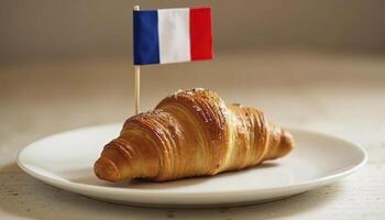 Croissant bread on a white plate with a small french flag photo