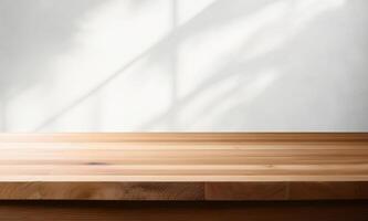 An empty wooden table in front of a wall photo