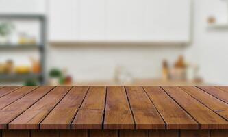 Wooden table top in kitchen with blurred background photo