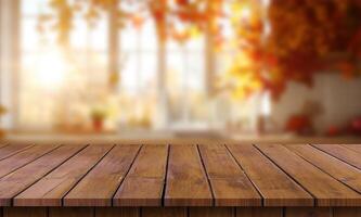 Empty wooden table with autumn leaves in the background photo