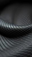 A close up of a black, woven fabric photo