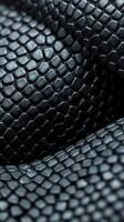 A close up of a black snake skin photo