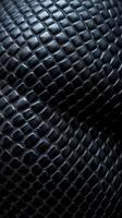 A close up of a black snake skin photo