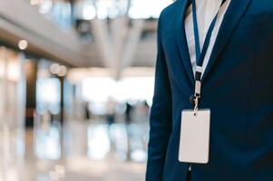 A man in a suit and tie holding a badge photo