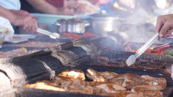 Grilling chicken at a market video