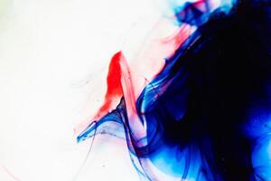 Abstract Pattern of Blue and Red Ink Mixing in Water. A Visually Captivating and Dynamic Composition Showcasing Fluid Dynamics and the Aesthetic Appeal of Abstracts photo