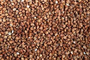 Close-Up View of Buckwheat Groats - Ideal for Nutrition Articles, Culinary Blogs, and Health-Related Marketing Materials photo