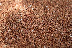 Close-Up View of Buckwheat Groats. Ideal for Nutrition Articles, Culinary Blogs, and Health-Related Marketing Materials photo