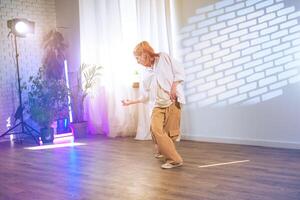 Dynamic dance performance highlighting expressive movement in a well-lit studio during an afternoon session photo