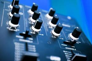 Close up image of mixer in blue toned.Music objects photo