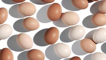 Pattern of Brown and White Eggs with shadows, minimal aesthetic holiday banner background, isolated natural organic chicken eggs, breakfast ingredients, minimalist food composition, neutral color photo