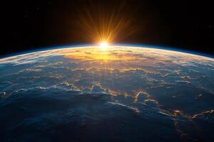 Sunrise illuminating earth's atmosphere and clouds from space photo