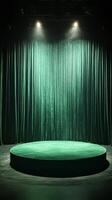 Green stage with spotlight and green curtain photo