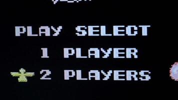 Player selecting one player mode on retro arcade game. 8 bit retro vintage console video