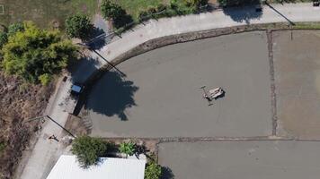 Aerial shot of a tractor working in a field, preparing the soil for planting in a rural area. video