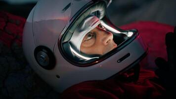 Astronaut With Helmet Falls Asleep On A Mountain At Night Alone Thinking video