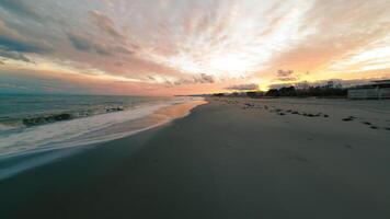 Romantic Red Sky With Waves Crashing On Deserted Beach In Winter In Sicily video