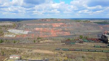 Aerial view Industrial coal mining at the mine. Mountains of coal lying on an old mine. video