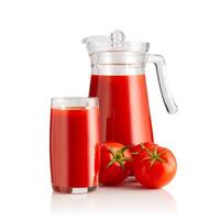 A refreshing glass and jug of freshly squeezed tomato juice, accompanied by two ripe tomatoes, perfect for a healthy snack or meal addition, bursting with flavor and nutrition. photo