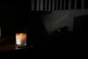 Cozy Candle Glow in Dim Light photo
