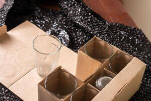 Unpacked Glassware in Cardboard Box photo