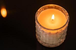 Lit Candle in Decorative Glass photo