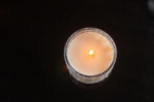 Lit Candle in Glass Jar photo