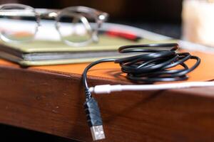 A black cord on a table photo