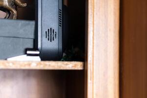 Close-up of a Wooden Shelf with Electronics photo
