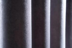 A close up of a curtain with a dark gray color photo