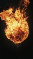 A soccer ball is on fire in the air photo