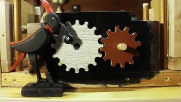 mechanism of an old toy, bird, rotates gears, close-up, loop video