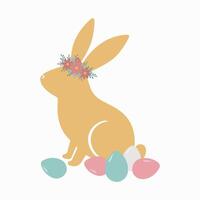 rabbit in a wreath and easter eggs vector
