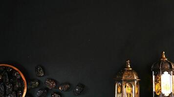A Plate Of Dates And Two Islamic Lanterns With Copy Space photo