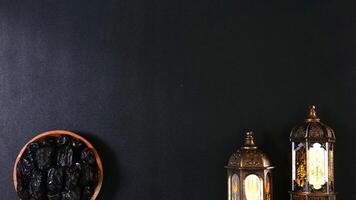 A Plate Of Dates And Two Lanterns Decoration With Copy Space photo