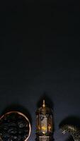 A Plate of Dates With Islamic Lanterns on Black Background photo