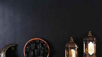 A Plate Of Dates And Islamic Decorations With Copy Space photo