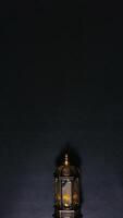 A Lighted Lantern on Black Background photo