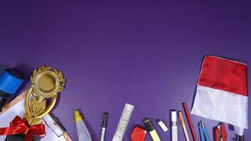 School Stationery with Notebook and Wooden Board Isolated on Purple Background with Copy Space area Back to School Concept photo