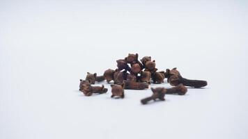 Pile of Cloves Spice with Selective Focus Isolated on White Background photo