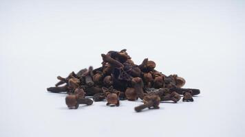 Pile of Dried Cloves Isolated on White Background photo
