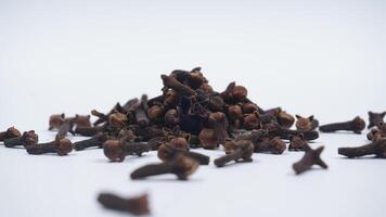 Scattered Cloves with Selective Focus Isolated on White Background photo