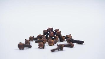 Scattered Cloves Isolated on White Background photo